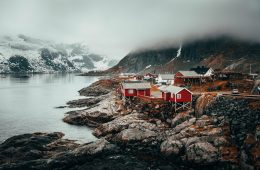 red and grey houses near river during daytime